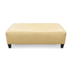 Baby Yellow leather ottoman with a long, low rectangular bench profile.