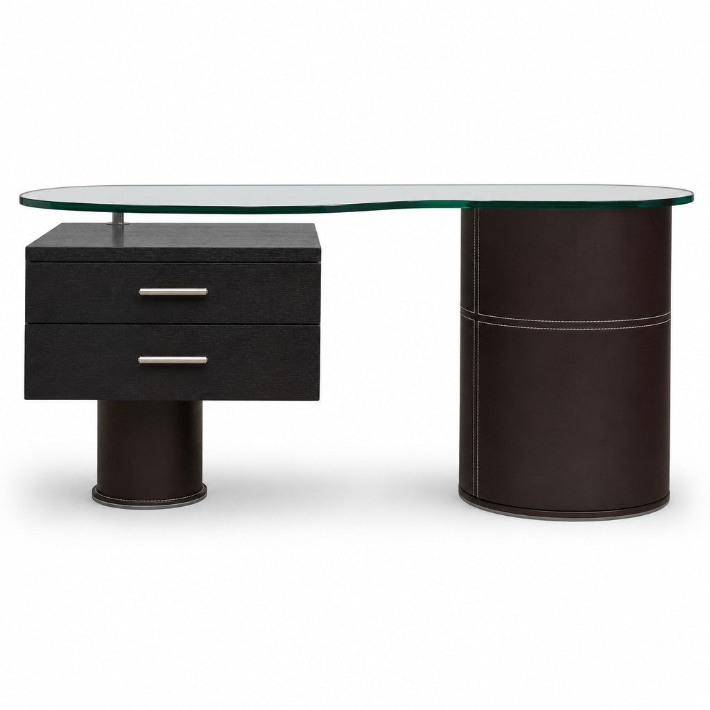 Black leather-topped mid-century executive desk with wood frame and glass accent
