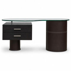 Black leather-topped mid-century executive desk with wood frame and glass accent