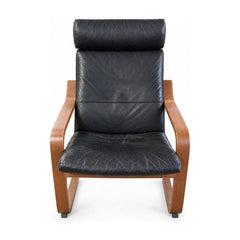 Black lounge chair with distressed fabric upholstery
