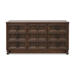 Dark brown mid-century wood dresser with a long low case and visible marks along the side.