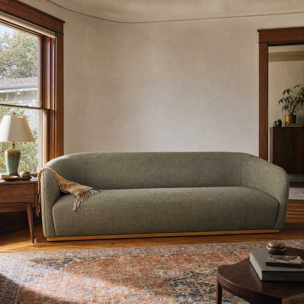 Green mid-century sofa with warm oak trim and clean horizontal lines - view 2