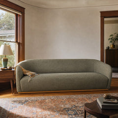 Green mid-century sofa with warm oak trim and clean horizontal lines - view 2