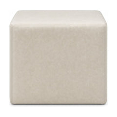 Cream square ottoman with cube silhouette and linen-like upholstery.