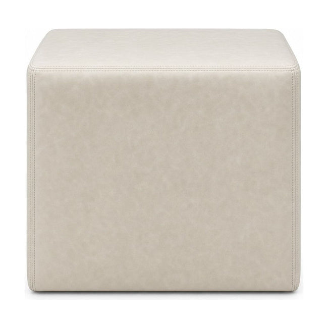 Cream square ottoman with cube silhouette and linen-like upholstery.