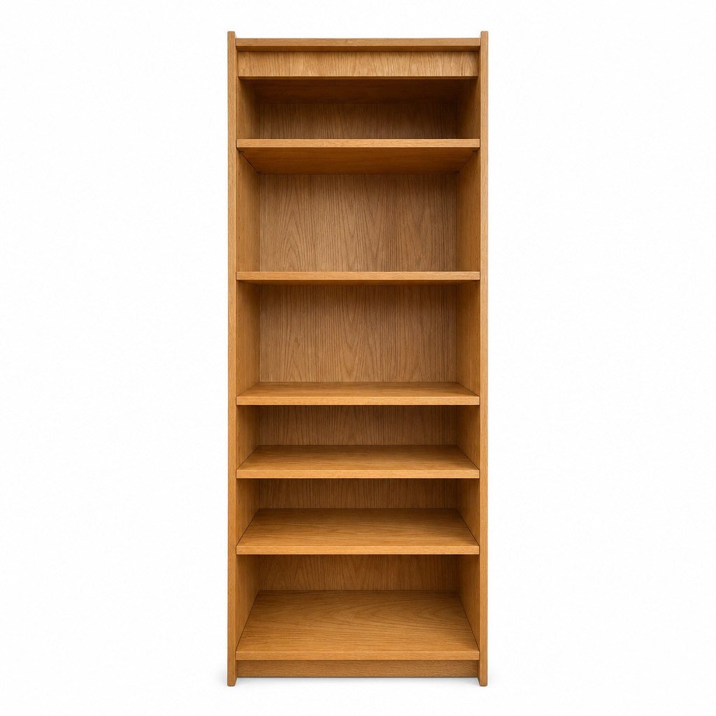 Honey oak mid-century bookcase with tall vertical shelving and clean lines