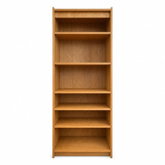 Honey oak mid-century bookcase with tall vertical shelving and clean lines