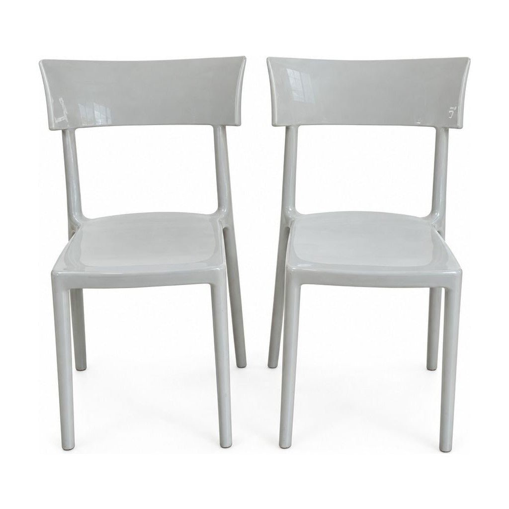 Light gray dining chairs with a single molded Catwalk shell by Kartell