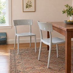 Light gray dining chairs with a single molded Catwalk shell by Kartell - detail view 1