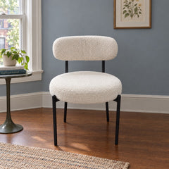 Cream boucle dining chairs with a looped texture and compact seat. - detail view 1