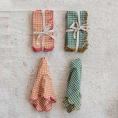 Green check napkins shown alongside the orange and pink colorway