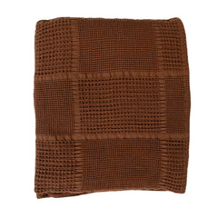 Folded stack of the brown cotton waffle weave throw showing the honeycomb texture depth - Creative Co-Op throw - Whats New Furniture Portland