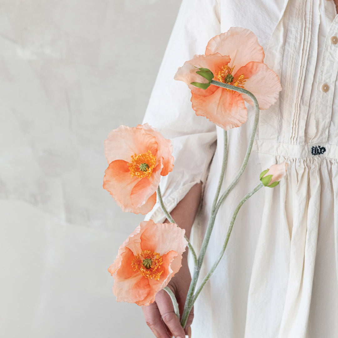 Faux poppy flower pick in pink and peach shown by hand for scale - Creative Co-Op - Whats New Furniture Portland OR