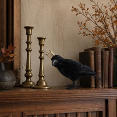 Black crowned crow figurine styled on a Portland Halloween mantel - Whats New Furniture