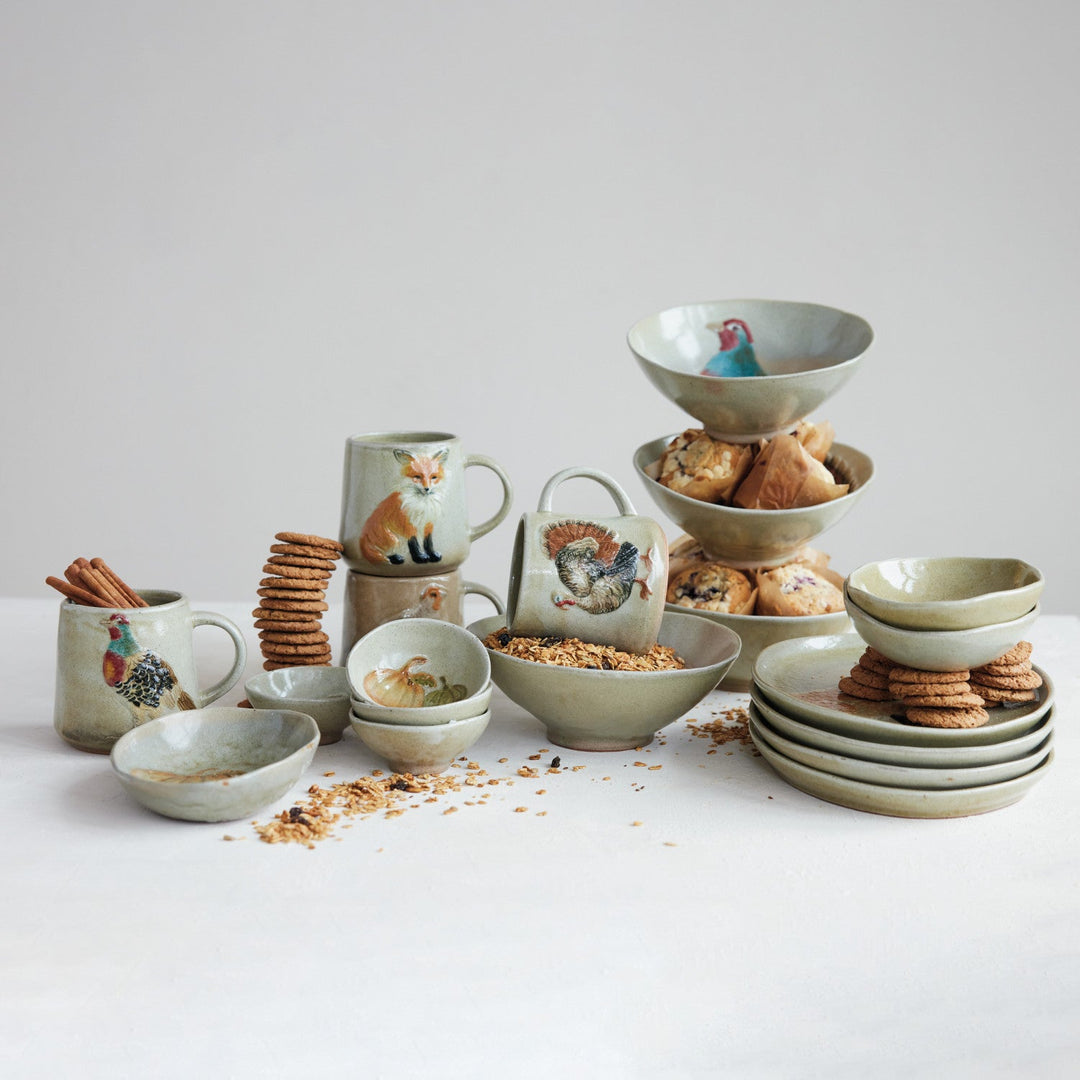 Woodland animal stoneware bowls styled on a harvest breakfast table with snacks and coordinating mugs in a Portland home - Whats New Furniture