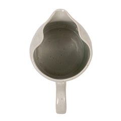 Overhead view of the creamer showing the sage glazed interior and pour spout