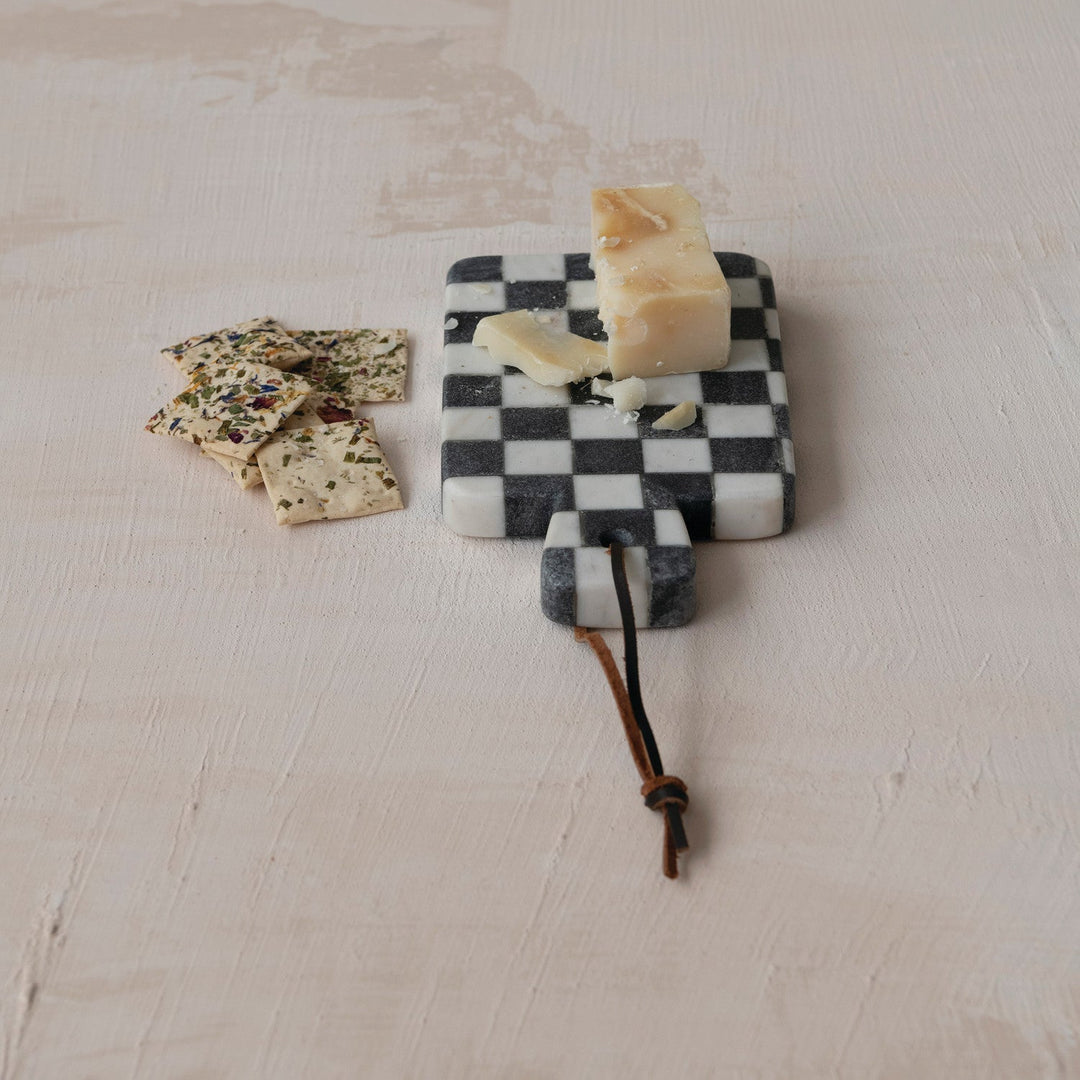 Marble check cheese board styled with cheese and crackers