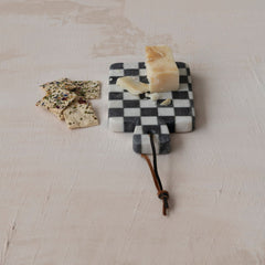 Marble check cheese board styled with cheese and crackers