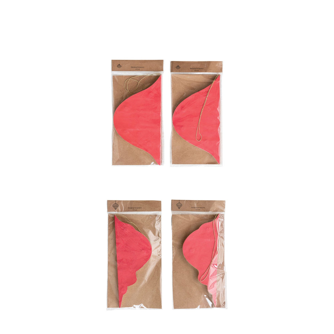 Paper honeycomb ornaments shown folded flat in their kraft packaging sleeves - Whats New Furniture Portland OR
