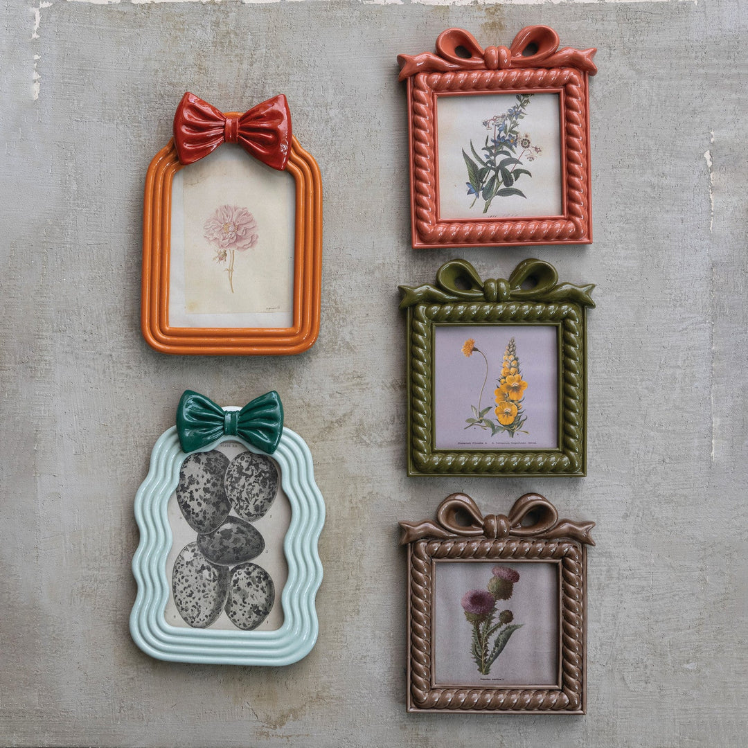 Resin Photo Frame with Bow, 2 Styles (Holds 4" x 6" Photo) grouped on a wall - decor by Creative Co-Op - Whats New Furniture Portland OR