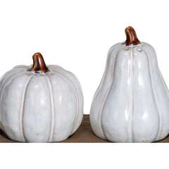 Close-up of the two white reactive glazed pumpkin shakers showing amber stems and glaze variation - Whats New Furniture Portland