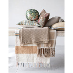 Stonewashed Cotton Slub Lumbar Pillow with Hand-Embroidered Flowers &amp; Bees, 20" x 14" styled on a bench with a throw - soft goods by Creative Co-Op - Whats New Furniture Portland OR