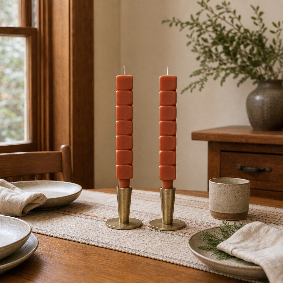 Rust stacked block taper candles styled on a Portland dining table - Whats New Furniture