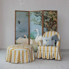 Vintage swan folding room divider styled in a Portland living room with a skirted armchair and striped ottoman - Whats New Furniture