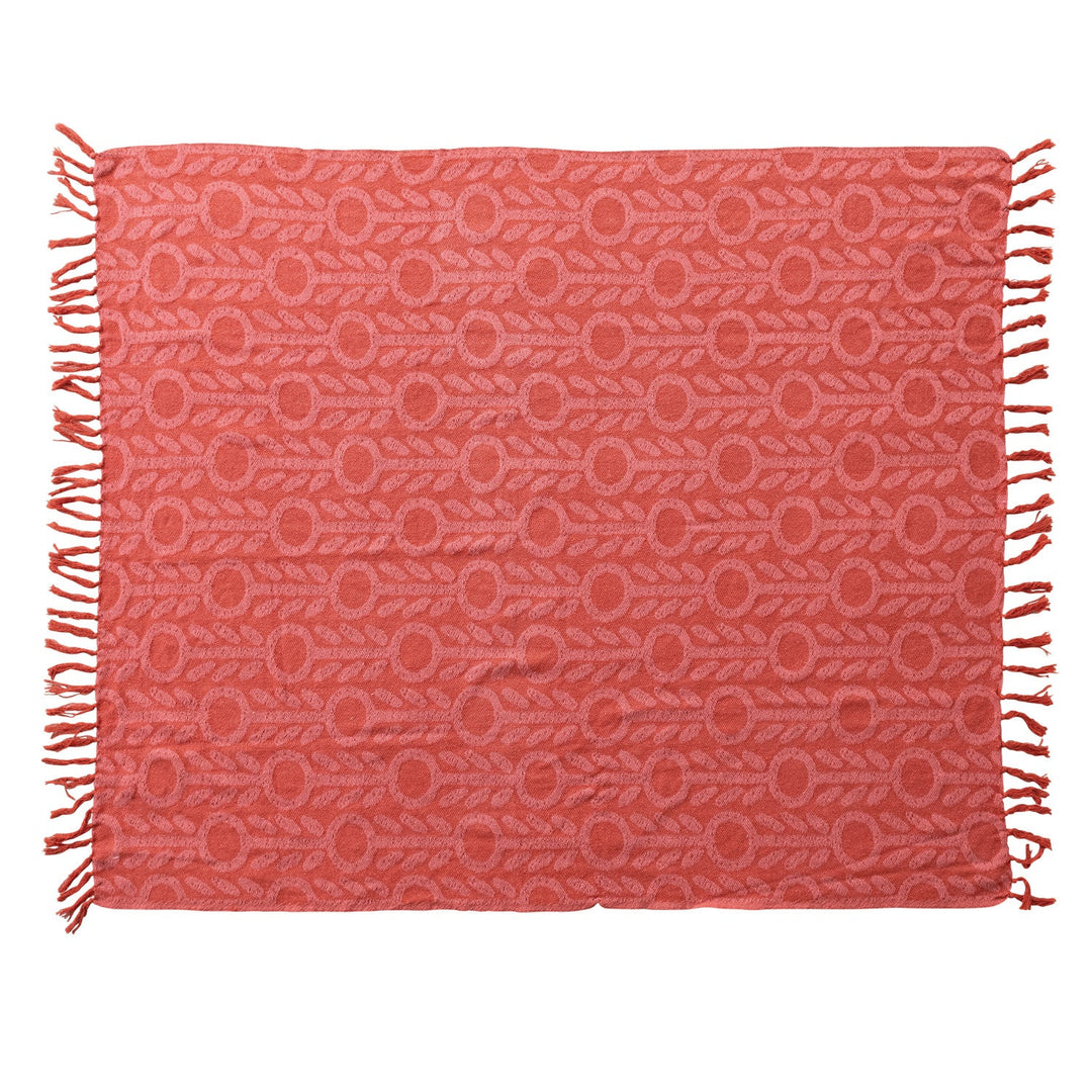 Woven Recycled Cotton Jacquard Throw with floral pattern and fringe in pink and red laid flat - throw by Creative Co-Op - Whats New Furniture Portland OR