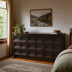 Dark brown mid-century wood dresser with a long low case and visible marks along the side. - detail view 1