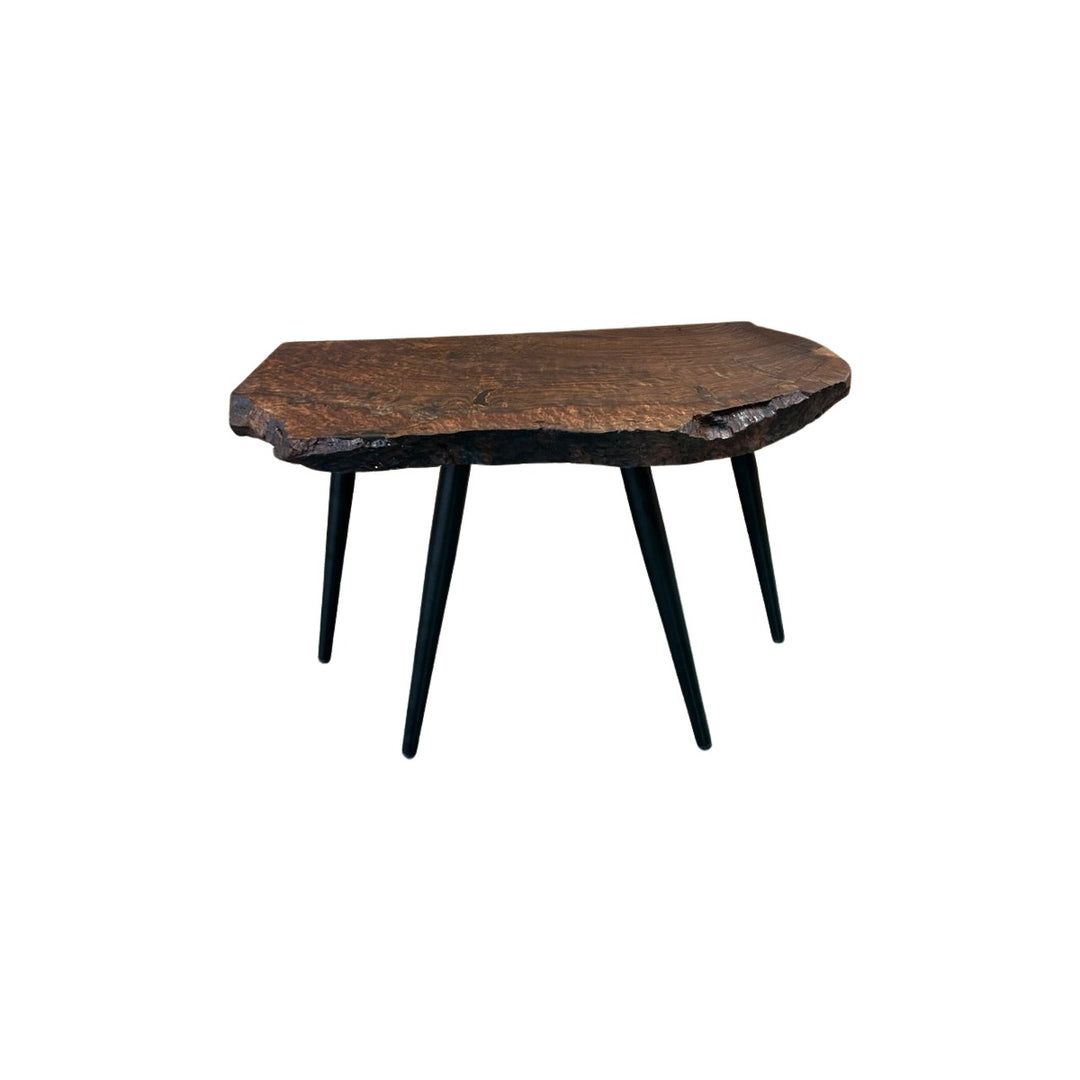 Dark walnut live edge accent table with a clear epoxy river fill on the top