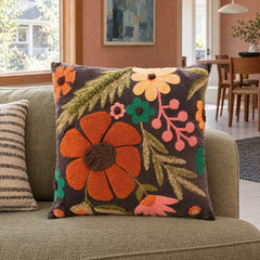 Multicolor embroidered velvet floral pillow styled on a sofa - Whats New Furniture Portland OR