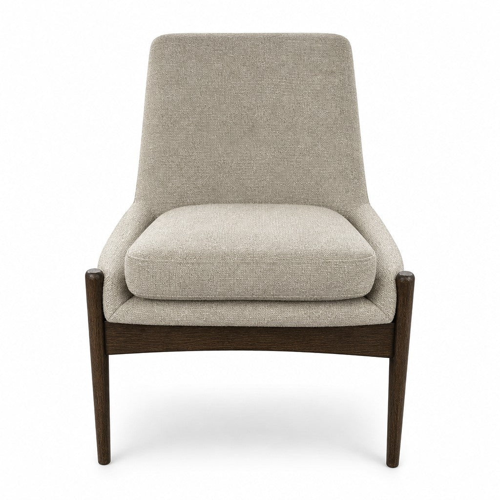 Beige upholstered dining chair with a curved back by Four Hands