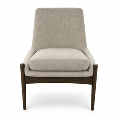 Beige upholstered dining chair with a curved back by Four Hands