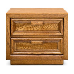 Golden solid walnut nightstand with compact mid-century silhouette and visible grain.