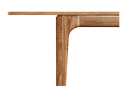 Hereford Butterfly Dining Table in Hazelnut Brown close-up of rounded corner and tapered leg joinery - acacia dining table by NPD - Whats New Furniture Portland OR