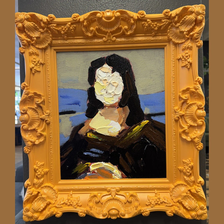 Framed acrylic portrait painting in a carved orange baroque frame, photographed in the What's New Furniture showroom