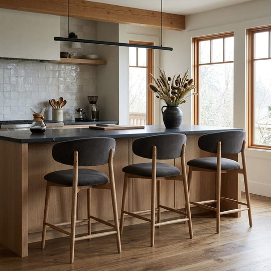 Milo Counter Stool in Slate Charcoal fabric styled at a kitchen island in a Portland Craftsman kitchen with white oak cabinets and honed soapstone — What&