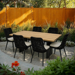 Naples Outdoor Dining Set with 6 Chairs on a stone paver patio - What&