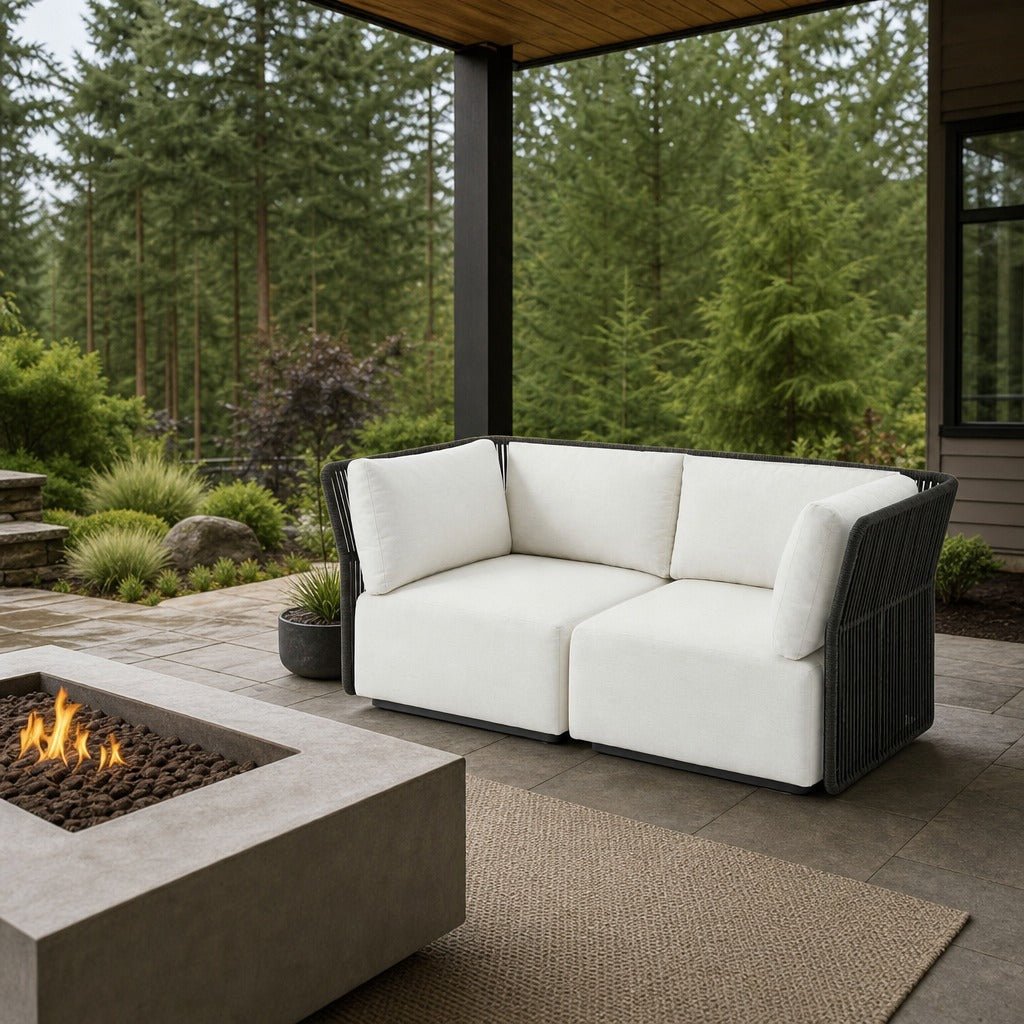 Naples Outdoor Loveseat on a covered outdoor veranda with a low fire table nearby - What&