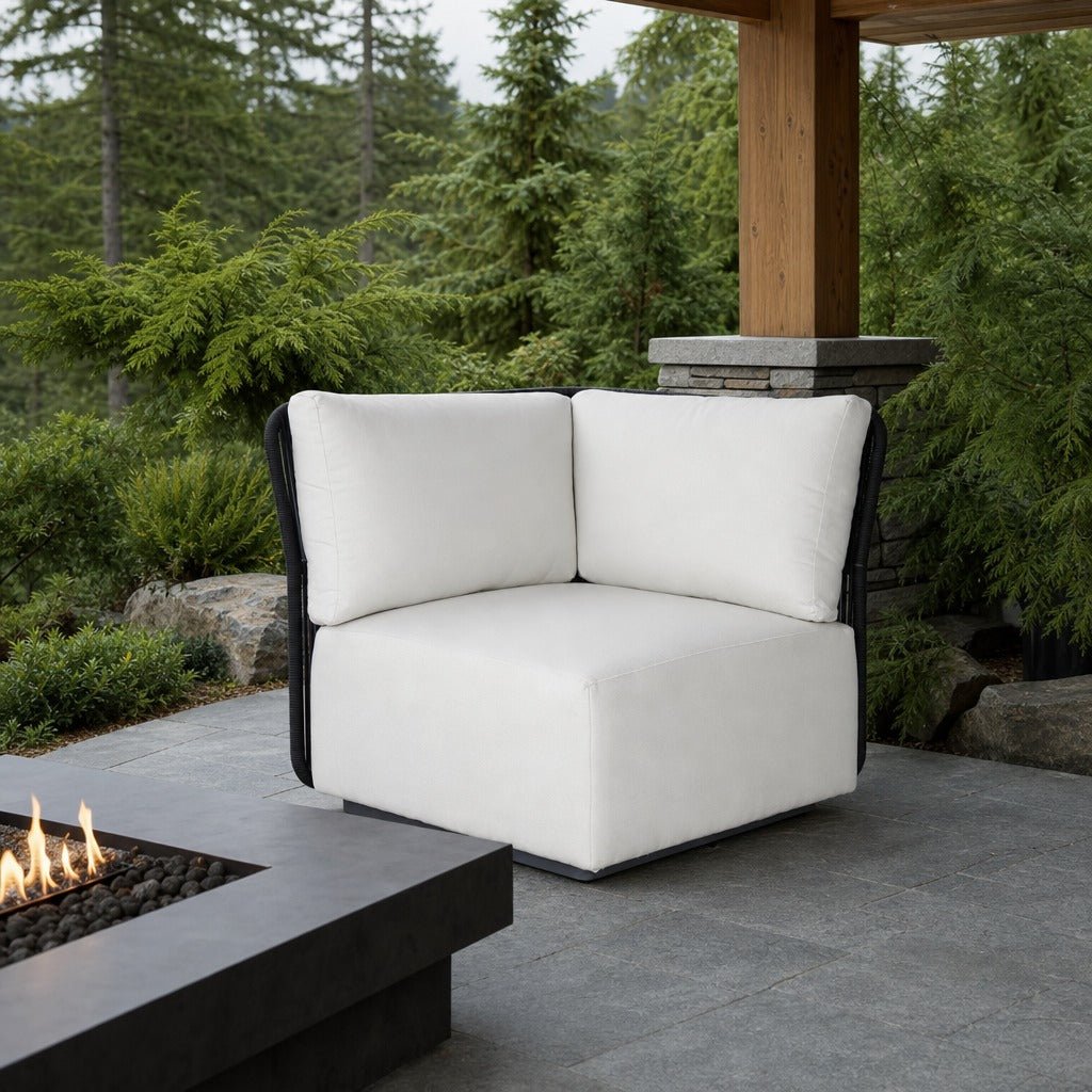 Naples Outdoor Sectional Corner on a covered outdoor veranda with a low fire table nearby - What&