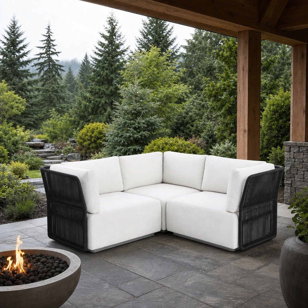 Naples Outdoor Small Sectional on a covered outdoor veranda with a low fire table nearby - What&