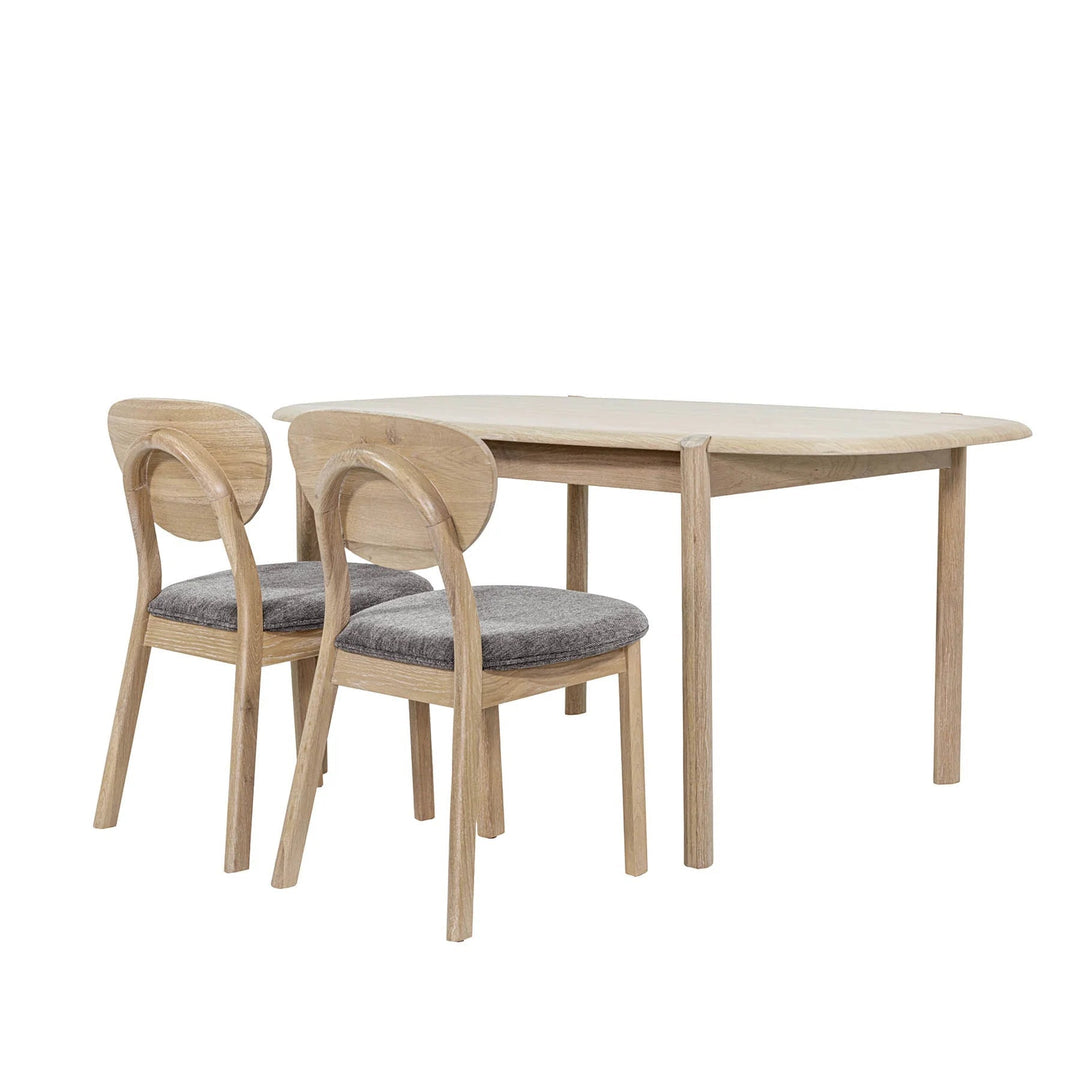 Runway Dining Table in Light Oak, studio view with two dining chairs - Whats New Furniture