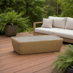 Siesta Outdoor Coffee Table on a cedar deck beside an outdoor lounge setting - What&
