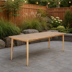 Sonoma Outdoor Dining Table on a stone paver backyard patio with a warm cedar fence - What&