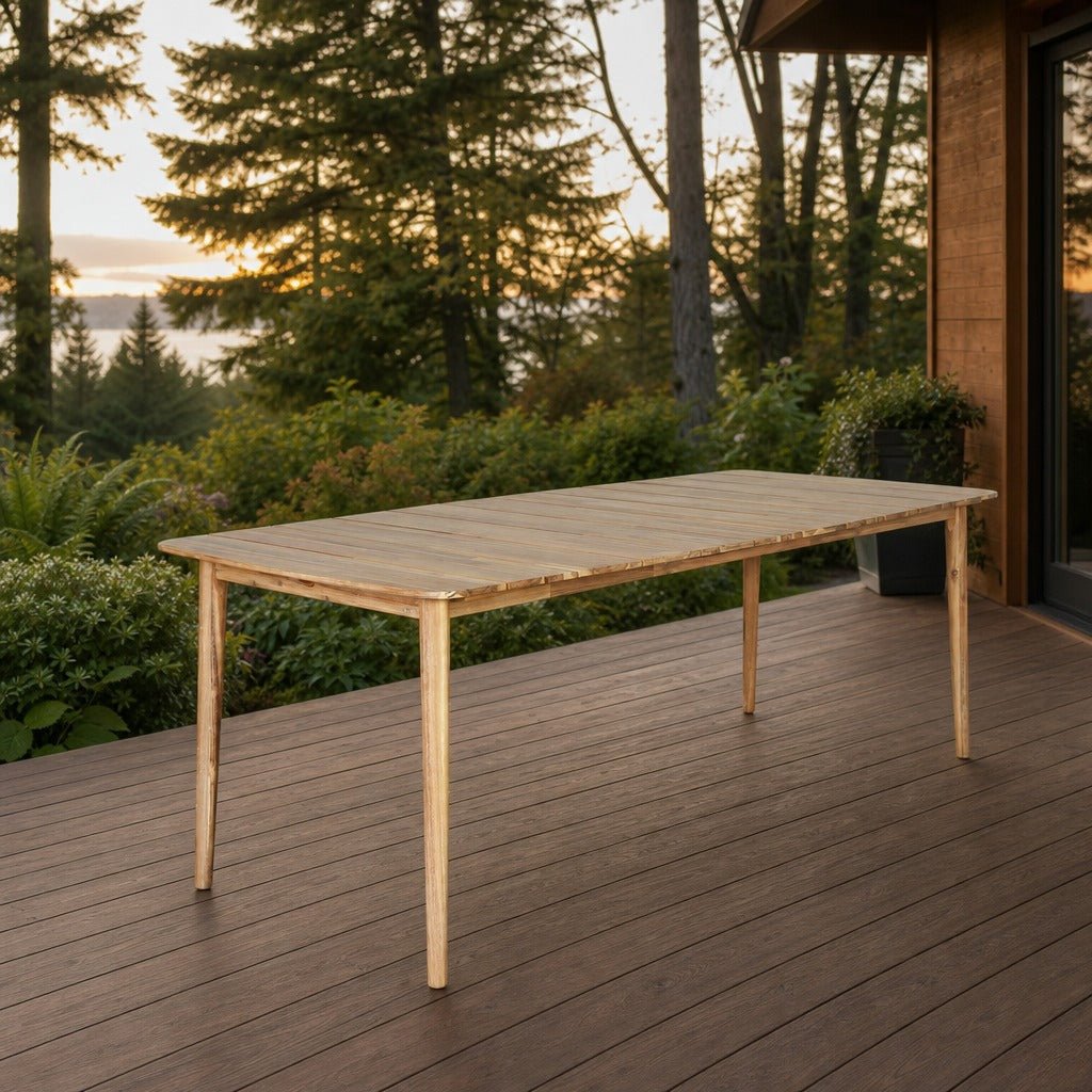 Sonoma Outdoor Dining Table on a spacious cedar deck overlooking a leafy Pacific Northwest garden in soft evening light - What&