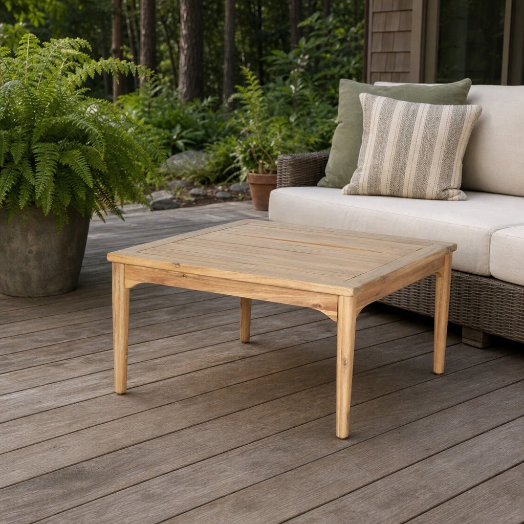 Sonoma Outdoor Square Coffee Table on a cedar deck beside an outdoor lounge setting - What&
