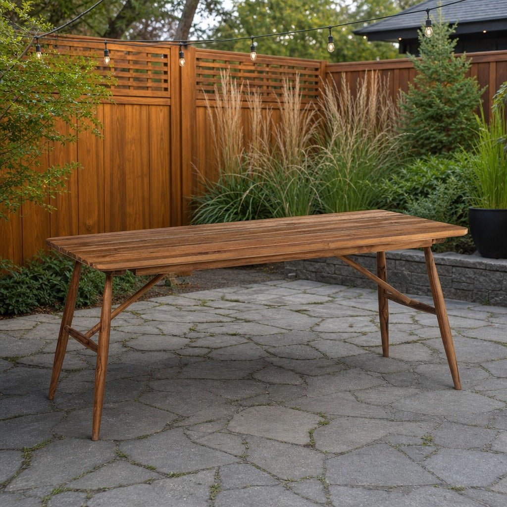 Vineyard Outdoor Dining Table on a stone paver backyard patio with a warm cedar fence - What&
