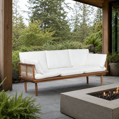 Vineyard Outdoor Sofa on a covered outdoor veranda with a low fire table nearby - What&