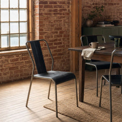 Vintage Stacking Dining Chair in Black styled in Portland converted warehouse flat with warm exposed brick and fir timber beams (no steel, no concrete) dining room - Whats New Furniture